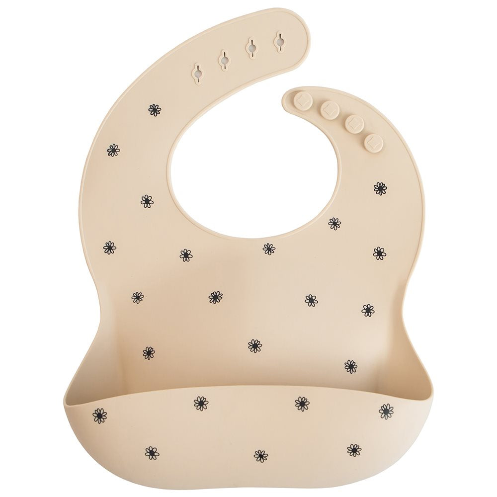 Mushie : Bavoir en silicone "Black Daisy"
