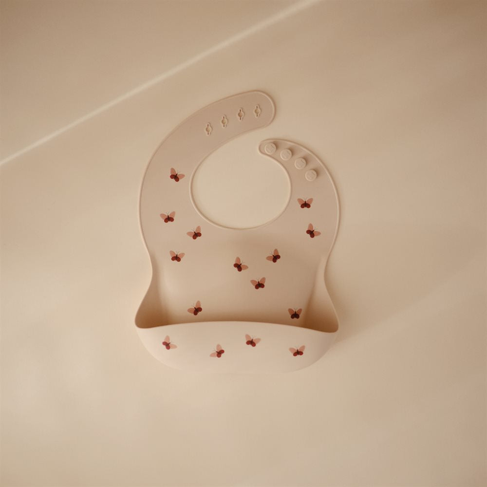 Mushie : Bavoir en silicone "Papillons"